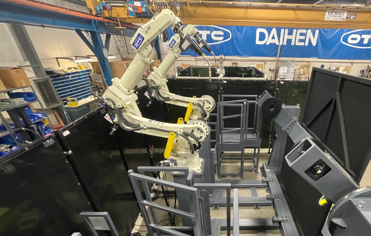 OTC DAIHEN dual robotic automation welding cell.