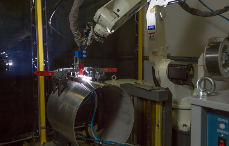 OTC DAIHEN robotic welding robot used on manufacturing floor.